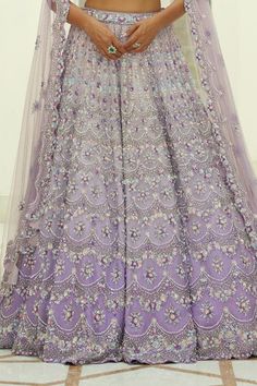 Lilac ombre organza lehenga embroidered in tonal and contrast beads, sequins and crystals in a trellis pattern and attached cancan. Paired with an embroidered padded choli and dupatta.
Components: 3
Pattern: Embroidered
Type Of Work: Sequin, Bead, Crystal
Neckline: Sweetheart
Sleeve Type: Sleeveless
Fabric: Organza, Satin
Color: Purple
Other Details: 
Attached cancan
Padded Blouse
Approx. product weight: 7 - 9 kgs
Lehenga length: 45 inches
Occasion: Wedding, Bride - Aza Fashions Organza Gown With Dori Work For Reception, Fusion Style Lehenga With Zari Work For Diwali, Fusion Style Wedding Sharara With Dupatta, Fusion Style Sharara For Wedding And Festivals, Festive Fusion Lehenga For Wedding, Fusion Wedding Sets With Resham Embroidery, Fusion Style Wedding Sets With Sheer Dupatta, Fusion Wedding Sets With Sheer Dupatta, Fusion Style Lehenga With Traditional Drape For Wedding