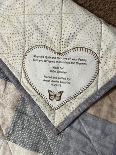 a quilted heart with a poem written on it