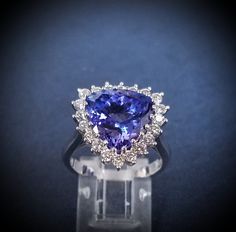 Gorgeous "Trillion Tanzanite " 6.70cts and 1.00cts of Dias..on 18ktWG...Size 7.5....Sizing to your Fit... Tanzanite Ring, Oct 30, Rings Statement, Favorite Jewelry, Statement Rings, Jewelry Rings, Bathing Beauties, Angeles, Size 7