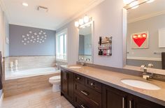 a bathroom with two sinks and a bathtub