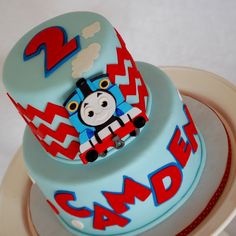 a thomas the train birthday cake on a plate