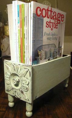 a magazine rack with books on top of it