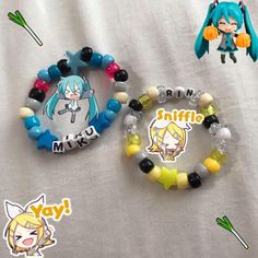 two bracelets with anime characters on them