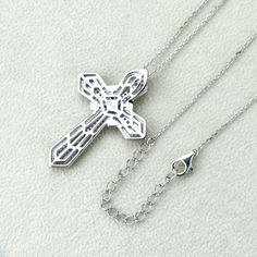 "925 Sterling Silver Platinum Plated; Platinum plating added to enhance shine and durability Stone Top Quality Cubic Zirconia Pendant Dimension; 28mm wide X 16mm long Chain 16\"+2\" extension" White Gold Cross Necklaces For Jewelry Making, Anniversary Clavicle Chain Cross Necklace, Silver Cross Necklace With Diamond Cut, Silver Diamond Cut Cross Pendant Necklace, Silver Crucifix Necklace With Diamond Cut, Silver Diamond Cut Crucifix Necklace, Cross-shape Cubic Zirconia Necklace With Vvs Clarity, White Cubic Zirconia Cross Pendant Jewelry, Pendant Necklace Men