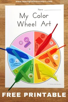 a printable color wheel with scissors and crayons in it on a wooden table