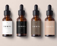 three bottles of thripy are lined up in a row on a beige background