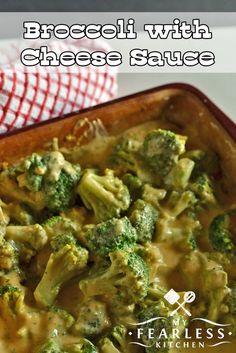 broccoli with cheese sauce in a casserole dish on a red and white checkered napkin