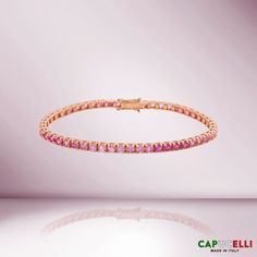 Beautiful Sapphire Tennis Bracelet. A staple in your jewelry collection. Handmade in Italy. This tennis Bracelet showcases a delicate box chain embellished with dozens of shimmering Pink Sapphires. Quality to us is important and that is why we hand select our diamonds for premium quality. ≫ Round Pink Shaded Sapphires : ◈ Carats: 11.50 ct. Carat (For 7 Inches Bracelet, other length will vary) ◈ 3.10mm Diameter *** Please consider 5% inaccuracies to the final product Elegant Pink Sapphire Bracelets, Luxury Pink Sapphire Bracelets, Luxury Pink Diamond Jubilee Bracelet, Luxury Pink Tennis Bracelet Gift, Luxury Pink Gemstone Tennis Bracelet, Luxury Pink Tennis Bracelet, Romantic Colors Palette, Round Sapphire, Diamond Tennis Bracelet