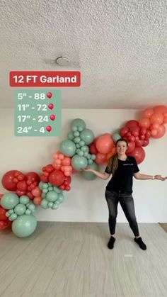 a woman is standing in front of balloons