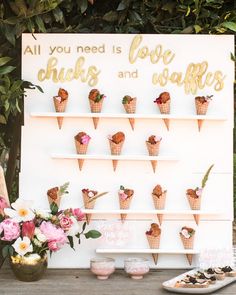 an ice cream display with flowers and cookies