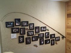 a fishing pole mounted to the side of a wall with pictures on it and an arrow