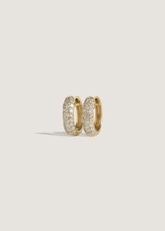 Diamond huggies are an essential piece in any jewelry collection. Synonymous with Kinn and our ethos, this bold pair is a reinvention of the classic pavé huggie. 14k solid gold—always Weight: 0.9g per earring Width: 3.5mm Inner diameter: 9.5mm Total diameter: 12.5mm Total carat weight: 0.59ctw Diamond cut: Round Diamond color: G/H Diamond clarity: SI Secure snap hinge closure Fall Rings, Diamond Huggies, Diamond Stacking Rings, Earrings Diamond, Diamond Bar, Stacked Jewelry, Large Hoop Earrings, Huggie Earrings, Silver Accessories