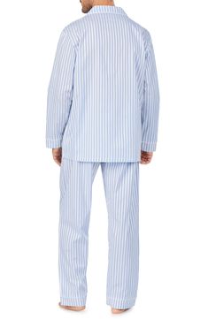 Stripes of cloudy white and blue further the relaxed attitude of pajamas made of cool cotton sateen in a fit that's comfortable and perfect for drifting off. Top has front button closure; notched lapels; long sleeves; chest patch pocket Pants have elastic/drawstring waist; side pockets 100% cotton Machine wash, tumble dry Imported Men's Clothing Blue Cotton Sleepwear For Home, Blue Relaxed Fit Sleepwear For Home, Blue Cotton Sets With Long Pants, Striped Pyjamas, Notch Collar, Pocket Pants, Pj Sets, Woven Cotton, Cotton Weaving