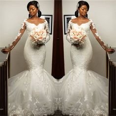 a woman in a wedding dress standing next to a mirror with her hands on her hips