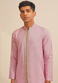 Featuring a stylish Lilac Silk Kurta Set, this ensemble includes a button-down kurta designed with a Chinese collar and a hidden placket. The hand-embroidered details on Kurta add a touch of grace and sophistication. Teamed with elegant white pants, this kurta set combines traditional elegance with contemporary style. Perfect for special occasions like Mehendi or Sangeet. Composition : Chanderi Silk Care: Dry Clean Only and Vacuum Storage This product can be customized for sleeves, length and colour Delivery : 4-6 weeks as the product is hand crafted. Check Size Guide or choose MySize for free customisation (All Sizes above XL can be made at 15% additional cost) For more information and sizes please contact fabiliciousfashion@gmail.com or visit our Copenhagen studio. About the Designer : S Cotton Silk Bandhgala With Resham Embroidery, Cotton Silk Bandhgala For Designer Wear, Elegant Chanderi Bandhgala For Transitional Season, Designer Spring Wedding Kurta, Designer Chikankari Embroidery Kurta For Spring, Designer Spring Kurta With Chikankari Embroidery, Cotton Silk Bandhgala With Resham Embroidery For Spring, Spring Cotton Silk Bandhgala With Resham Embroidery, Spring Cotton Silk Sherwani With Resham Embroidery