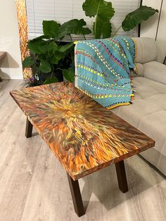 a coffee table sitting on top of a hard wood floor