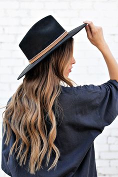 Ok, we're freaking out! The Joshua Hat is our newest favvvvv. It's everything a girl could dream of in a hat. Incredible quality, a pointed rancher crown, super structured, and an elastic inner-band. Black is always in style and you'll be in love. The elegant crown is stiffened and shaped into a clean and ridged design, finished with a braided trim. It's timeless, will last forever, and adds the perfect touch of coolness to any look. -Rancher style hat with some edge -Incredible quality -Brim is Trendy Winter Hat Bands For Rodeo, Trendy Winter Rodeo Hat Bands, Black Fedora Hat For Ranch, Black Fedora For Ranch, Fedora For Country Events With Flat Crown, Black Wide Brim Hat For Fall, Black Wide Brim Costume Hat For Fall, Wide Brim Black Hat For Ranch, Black Brimmed Fedora For Ranch