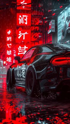 a black sports car parked in the rain on a city street with red neon signs