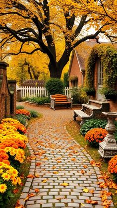 an autumn scene with flowers and benches in the foreground, on a cobblestone path