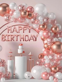 a birthday cake surrounded by balloons and confetti on a pink background with the words happy birthday