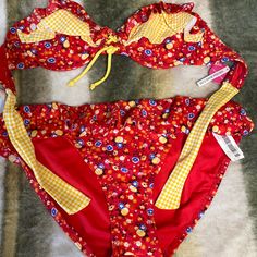 Kind Of A Country Style Bikini . Red Yellow, And Blue With Ruffles Never Worn Size Large. Retro Red Swimwear For Spring, Fun Red Swimwear For Pool, Red Fun Swimwear For Pool, Fun Red Swimwear For The Beach, Vibrant Red Swimwear For Poolside, Vibrant Red Swimwear For Beach Season, Vibrant Red Swimwear For The Beach, Vibrant Red Swimwear For Beach Party, Vibrant Red Swimwear For Beach