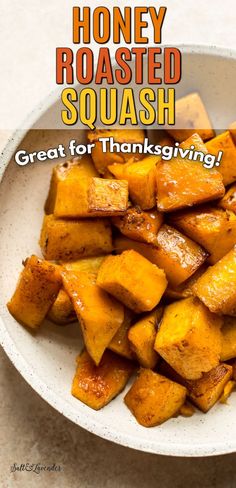 a white bowl filled with roasted squash on top of a table