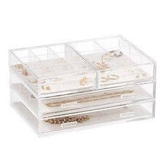 three clear drawers with jewelry in them