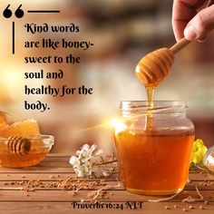 a honey jar filled with honey sitting on top of a wooden table