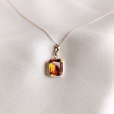 This stunning pendant is set in 14k Solid Yellow Gold with Natural Maderia Citrine with utmost precision. It is an unique gemstone pendant for nearly every occasion and is completely hassle-free jewelry. 🔷ABOUT GEMSTONE: Citrine, with its vibrant golden-yellow hues, is a gem of joy and abundance, radiating the warmth and energy of the sun. This captivating stone embodies qualities of positivity, success, and prosperity, believed to infuse one's life with a sunny disposition and enthusiasm. Citr Amber Citrine Gemstones For Gift, Yellow Gold Topaz Gemstones As Gift, Orange Jewelry With 17 Jewels As A Gift, Yellow Gold Citrine Gemstones For Gift, 14k Gold Amber Gemstone Necklace, 14k Gold Amber Gemstone Necklaces, Orange Citrine Necklace Fine Jewelry, Orange Faceted Jewelry Gift, Elegant Orange Emerald Cut Jewelry