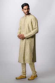 Olive kurta with floral print, zardozi embroidery and front buttons. Paired with churidar.
Component: 2
Pattern: Embroidered,Printed
Type Of Work: Floral
Neckline: Mandarin
Sleeve Type: Long Sleeves
Fabric: Tussar
Color: Green
Other Details: 
Front buttons
Zardozi work
Occasion: Puja, Wedding - Aza Fashions Semi-stitched Gold Kurta With Naqshi, Bollywood Style Chanderi Sherwani For Designer Wear, Reception Kurta In Raw Silk With Dabka Detailing, Unstitched Kurta With Dabka Work For Reception, Reception Kurta In Raw Silk With Dabka, Raw Silk Kurta With Dabka For Reception, Straight Kurta With Dabka And Kundan, Reception Raw Silk Kurta With Dabka, Raw Silk Dabka Kurta For Reception