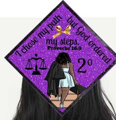 a purple graduation cap with an image of a woman