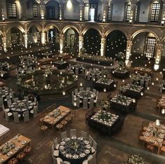 an indoor venue with tables and chairs set up for a formal function in the center