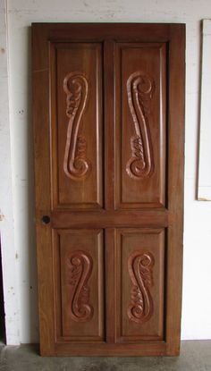 an old wooden door with carvings on it