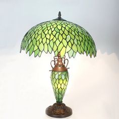 a green lamp sitting on top of a table