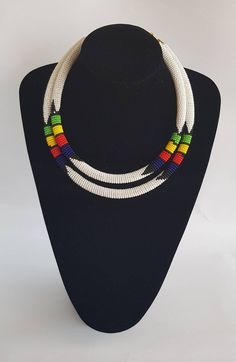 100% handcrafted using fine beads. The 2 strands are joined together to make one piece. Measurements; 19 inches for the long strand and 18 inches for the short one. **Buy multiple items and pay shipping for 1 item only.The rest ships free. More neckleces here; https://www.etsy.com/shop/TribalTess?ref=seller-platform-mcnav&section_id=21306083 Back to my shop; https://www.etsy.com/shop/TribalTess?ref=seller-platform-mcnav White Double Strand Beaded Necklace, White Double Strand Necklace With Colorful Beads, White Double Strand Beaded Necklace With Colorful Beads, Handmade White Double Strand Beaded Necklaces, Handmade White Double Strand Beaded Necklace, 2 In 1 Necklace, African Wedding Jewelry, African Necklace, Handmade African