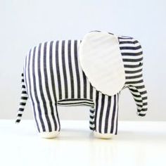 an elephant made out of black and white striped fabric