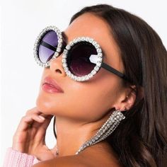 Glamorous Design Experience the ultimate in luxury with our Oversized Rhinestone Round Sunglasses. The dazzling rhinestone decoration adds a touch of glamour, making these shades a perfect accessory for any stylish outfit. Ultimate Eye Protection Stay safe under the sun with UV400 protection, ensuring your eyes are shielded from harmful sun rays. Enjoy your outdoor activities without worrying about your eye health. Stylish Oversized Frames The oversized round frames are not only fashionable but Trendy Crystal Sunglasses With Rhinestones, Trendy Rhinestone Crystal Sunglasses, Silver Glamorous Ladies' Sunglasses, Elegant Rhinestone Sunglasses For The Beach, Party Sunglasses With Rhinestones And Crystal Material, Party Crystal Sunglasses With Rhinestones, Glamorous Silver Sunglasses With Glass Lenses, Glamorous Silver Glass Sunglasses, Elegant Crystal Sunglasses For Party