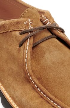 A lightweight lug sole serves as a study base for this low-profile suede chukka boasting a robust moc toe and cushioned footbed. Lace-up style Cushioned footbed with arch support Leather upper and lining/synthetic sole Imported Casual Chukka Boots With Moc Toe And Suede Lining, Casual Suede Moc Toe Chukka Boots, Classic Suede Chukka Boots With Vibram Sole, Casual Moccasins With Goodyear Welt Construction, Suede Chukka Boots With Vibram Sole, Casual Suede Moccasins With Vibram Sole, Suede Desert Boots With Goodyear Welt And Moc Toe, Casual Brown Desert Boots With Lug Sole, Casual Desert Boots With Goodyear Welt And Plain Toe