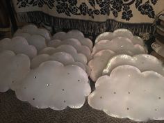 there are many trays that have been made to look like clouds on the floor