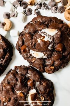 three cookies with marshmallows and chocolate chips