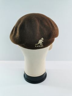 FREE EXPRESS SHIPPING WHEN PURCHASE MORE THAN $40USD * For sale is a used vintage Kangol hat. * Overall condition is 7/10 good. * Made in England. * 100% Wool. * Size M. * No major defect spotted. * Just signs of wear and ages. * Good in shape. * Please refer the pictures. SHIPPING We use DHL Express/FedEx Express. Approximately, shipping will take around 3 to 8 days to delivery. Please read the descriptions briefly and THANK YOU :) https://www.etsy.com/shop/PROjectaStore Additional notes: - We don't accept return regarding sizing and measurements issue. Green Kangol Hat, Vintage Brown Hats For Outdoor, Vintage Brown Beret Flat Cap, Vintage Brown Winter Baseball Cap, Vintage Brown Hat, One Size Fits Most, Vintage Brown Flat Cap, Vintage Brown Baseball Cap One Size Fits Most, Kangol Hat, Kangol Hats