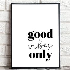 a black and white poster with the words good vibes only on it, against a brick wall