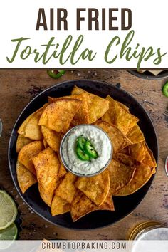 Air fried tortilla chips in a bowl with jalapeño dip in the middle. Chips From Tortillas, Air Fryer Tortilla Chips, Healthy Tortilla Chips, Fried Tortilla Chips, Dairy Free Queso, Vegetarian Nachos, Healthy Chips, Crispy Chips