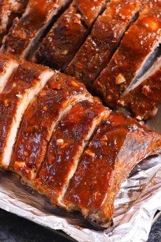 sliced meatloaf on tin foil sitting on top of a counter