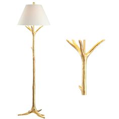 a lamp that is on top of a table next to a tree branch shaped light