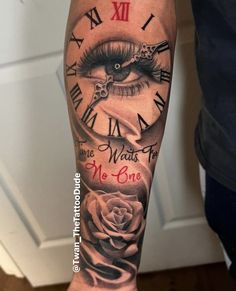 a person with a tattoo on their arm has a clock and rose in the middle