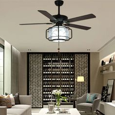 a living room filled with furniture and a ceiling fan