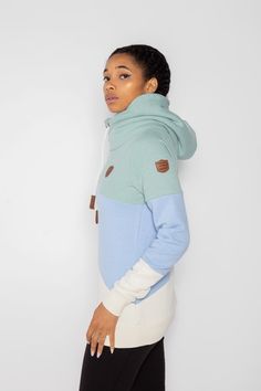 Women's Terry Colorblock Pullover Hoodie in Green Bay/Baby Blue Jay/Oatmeal Cowl neck hood with adjustable rope drawstrings and vegan leather caps Vegan leather Wanakome patch logo embroidered on chest and sleeve Brushed French terry interior FABRIC & CARE 65% Cotton, 35% Polyester Machine wash cold with like colors, inside out. Hang to dry. Do not bleach. Do not iron. Do not dry clean. Hoodie Xxl, Leather Cap, Interior Fabric, Blue Jay, Green Bay, Logo Embroidered, Cowl Neck, French Terry, Baby Blue