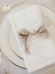 a white plate topped with a menu and silverware