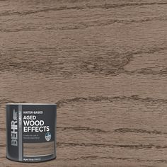 a can of wood effect paint sitting on top of a wooden floor